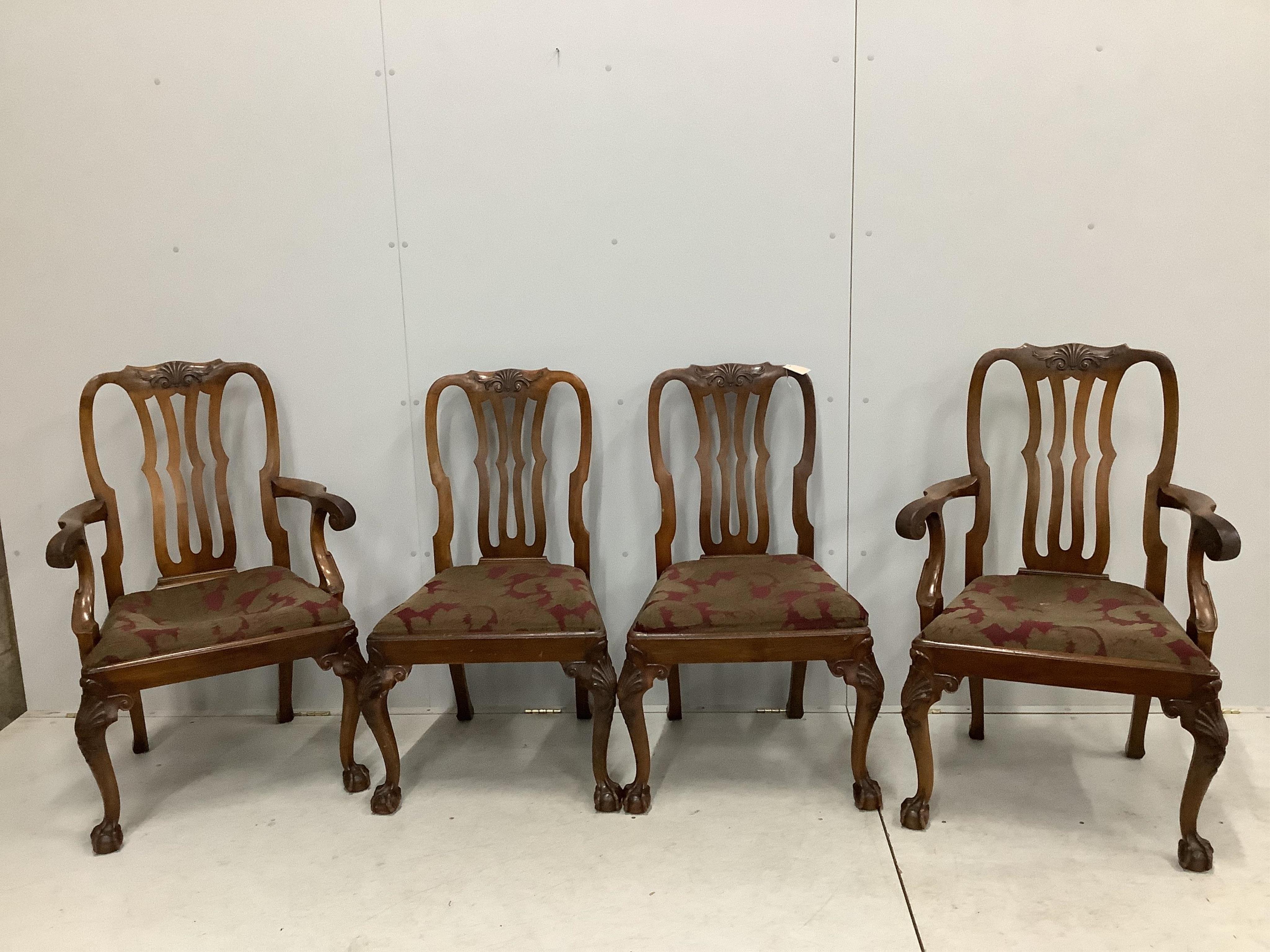 A set of eight George II style mahogany dining chairs on cabriole legs and ball and claw feet, two with arms. Condition - fair